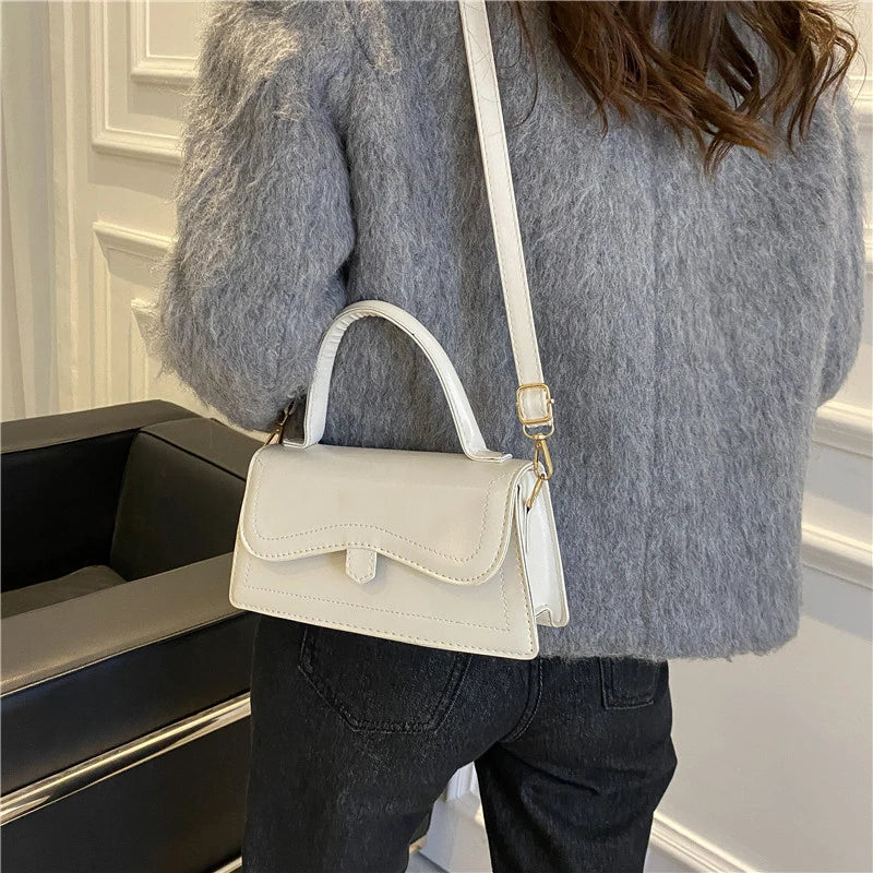 
                      
                        Solid mini handbag for women: elegance and practicality combined
                      
                    